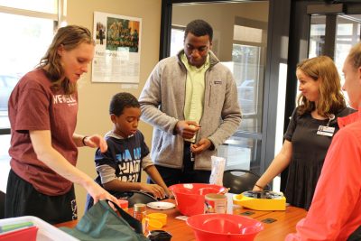 VTC medical student Jane Gay and Radford University Carilion students Alison Grant and Micah Jordan create a heart healthy snack with West End Center youth