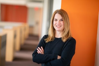 Jennifer Davis stands in academic building